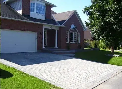 Asphalt driveway replaced with interlock paving — after