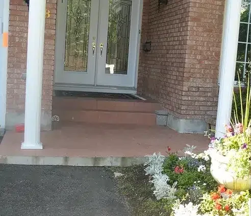 Concrete front entrance replaced with flagstone — before