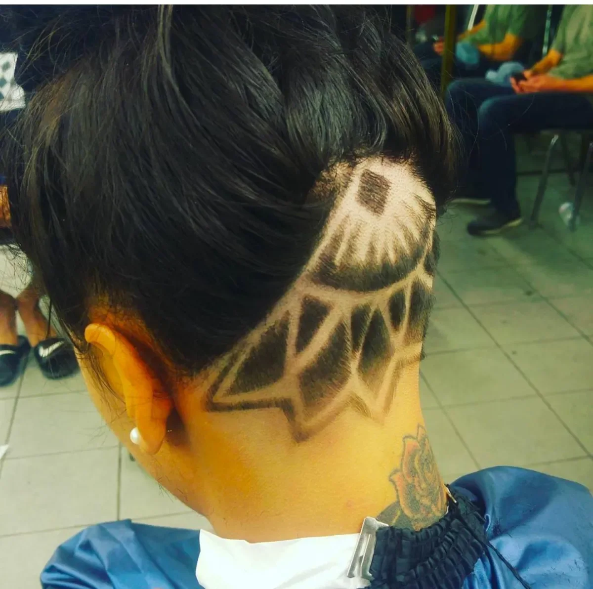 Geometric pattern shaved into a high fade