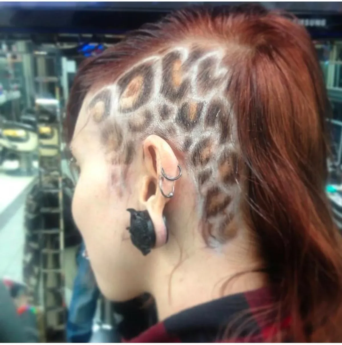 Detailed freestyle pattern shaved into a client’s hair