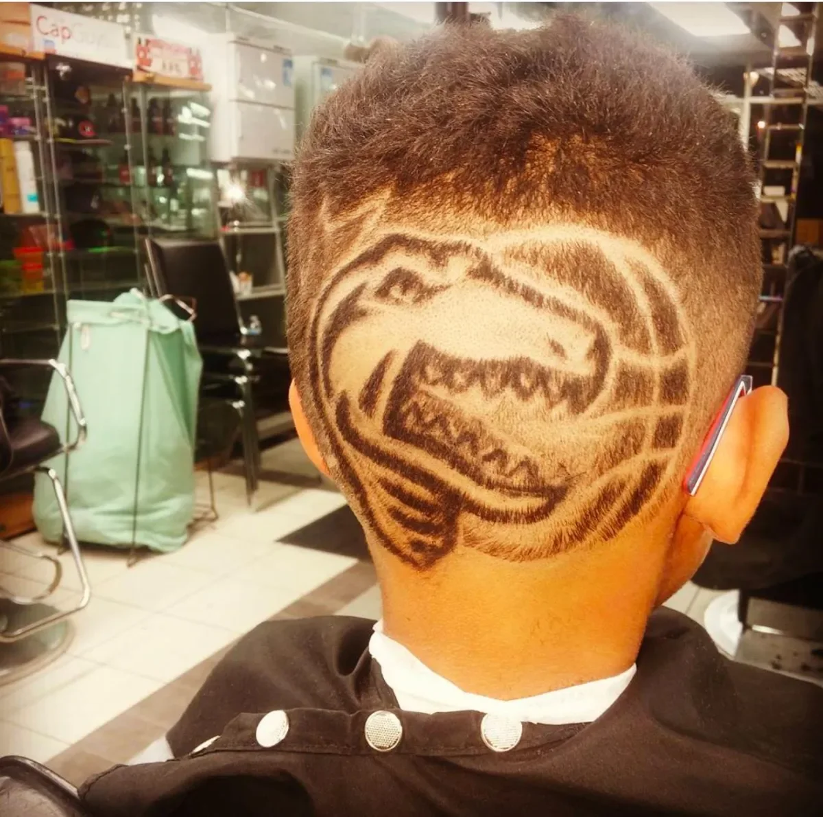 Sports team logo design cut into the back of the head