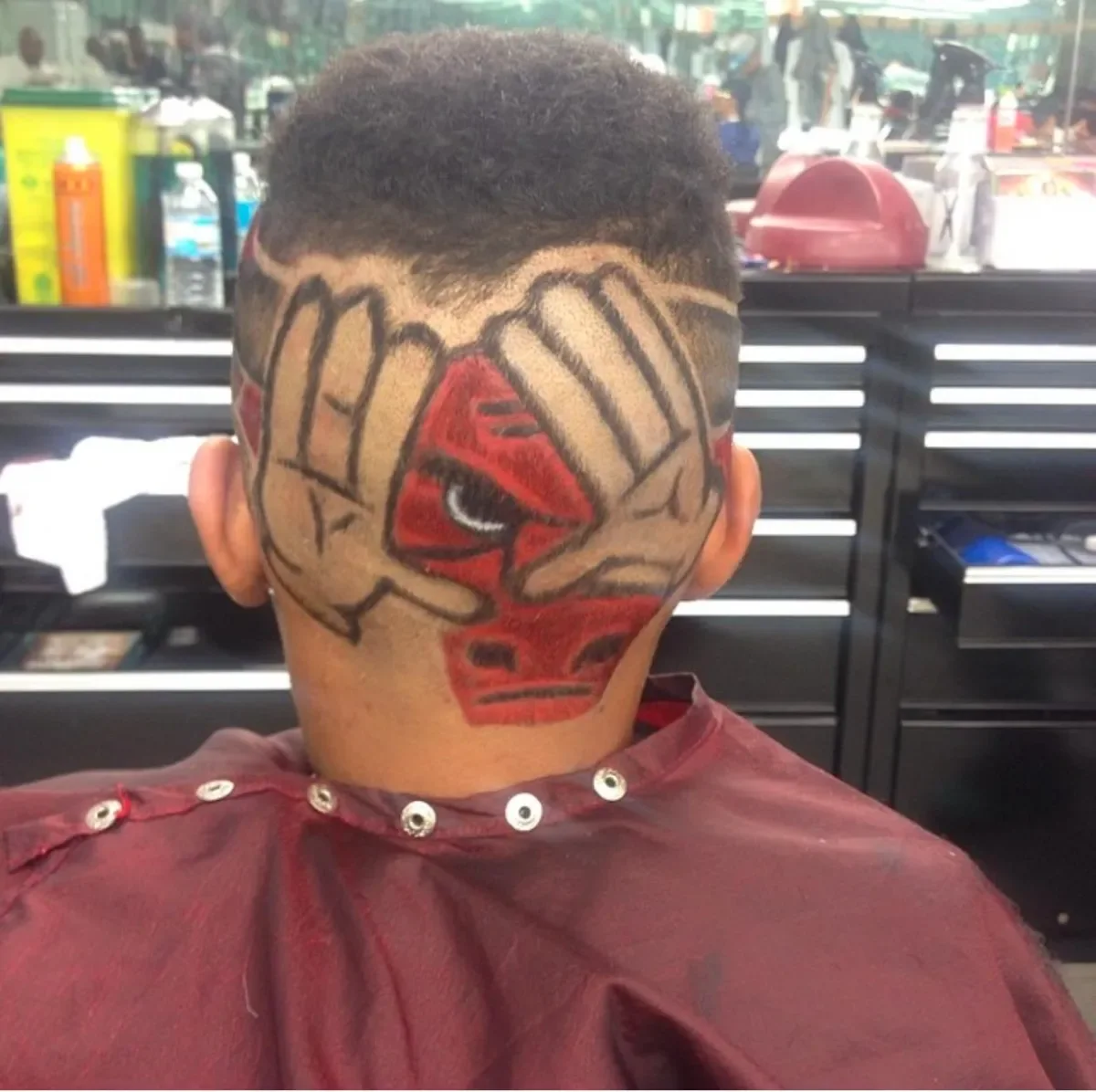Character logo design shaved into a fade