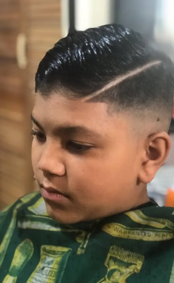 Young client after a clean side-part haircut